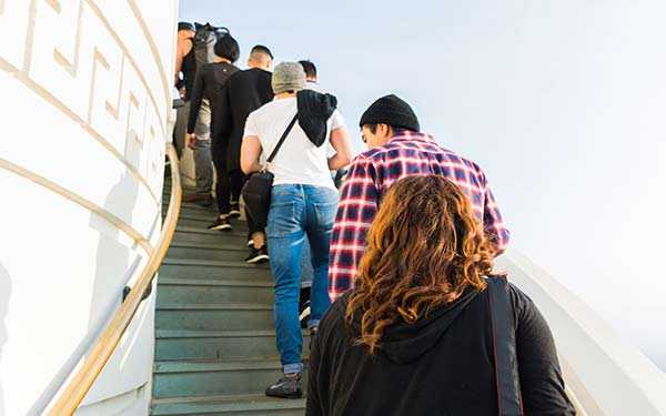 Line of people waiting on stairs Queue of People